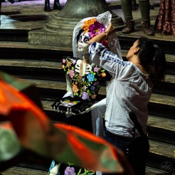 A Catrina doll being decorated