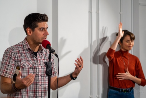 Carlos A. Gomez with sign language translator